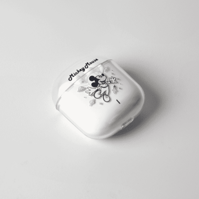 A white case for earphones featuring an illustration of Mickey Mouse and a logo.