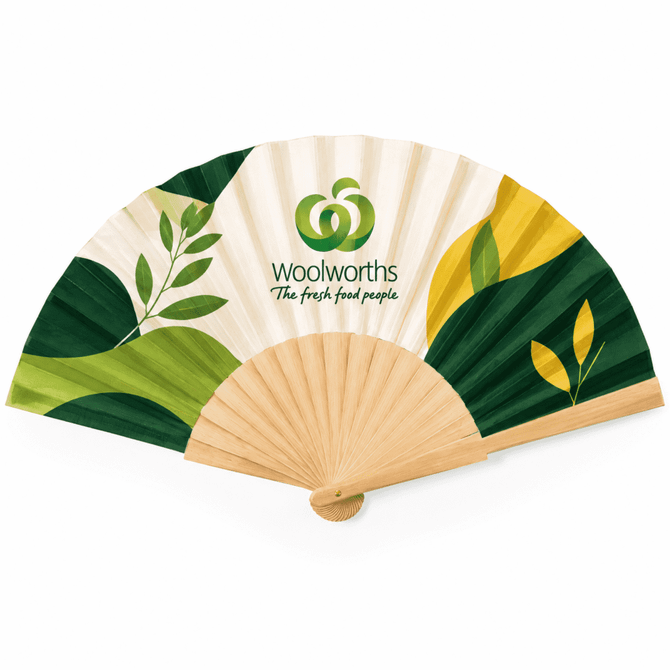 A wooden hand fan with a green and cream design, featuring leaf patterns and a logo.