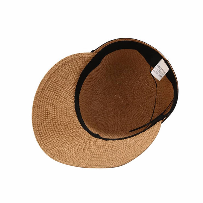 A straw hat with a wide brim and a black interior, featuring a label inside. It has a natural beige colour.