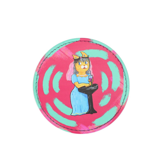 A circular PU coaster featuring a cat in a dress holding a drink, on a vibrant pink and teal background.