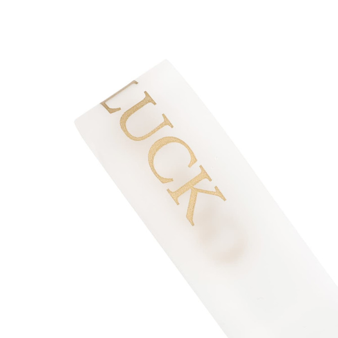 A soft white ribbon with gold text, featuring a logo or branding on the surface.