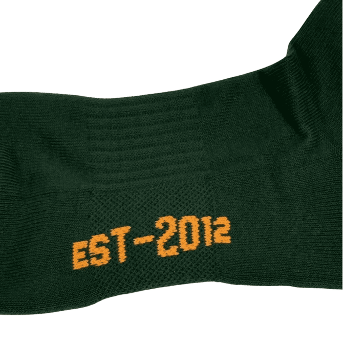 A pair of green socks featuring the year "EST 2012" in orange. The socks have a textured design and a logo.