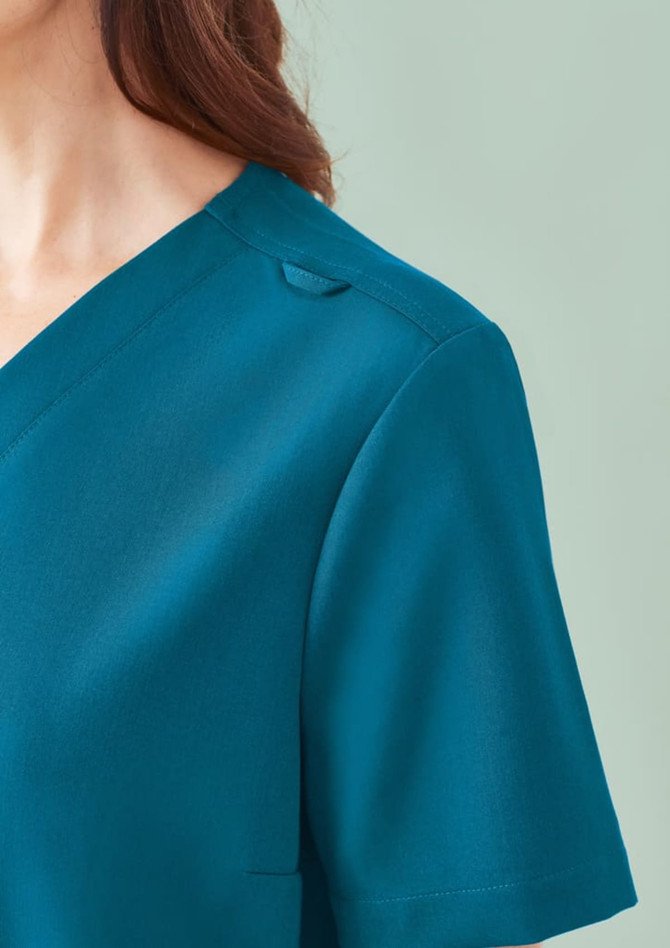 A teal women's V-neck scrub top featuring a short sleeve and a subtle shoulder detail.
