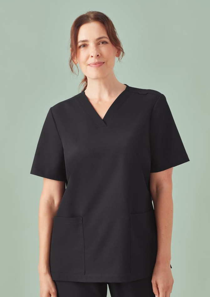 A black V-neck scrub top for women featuring short sleeves and two front pockets. It has a logo on the sleeve.
