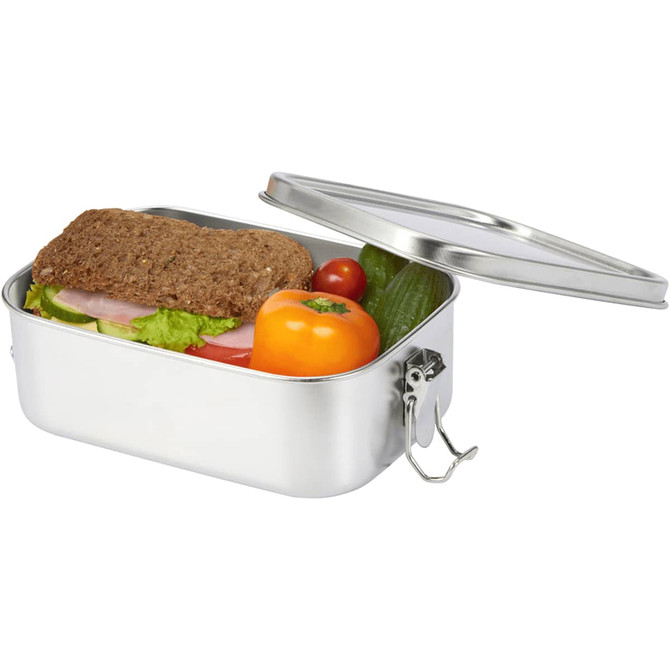 A stainless steel lunch box with a silver finish, containing a sandwich, tomatoes, cucumber, and a small orange.