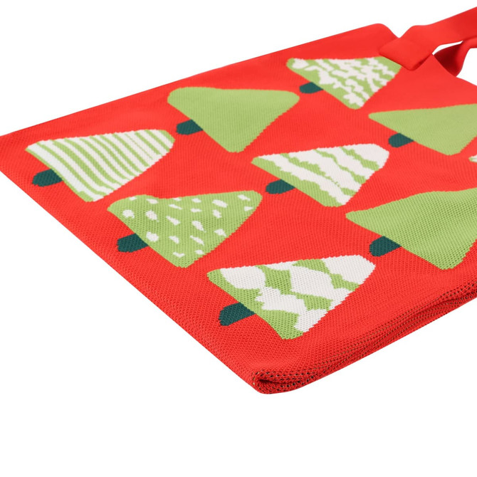 A red tote bag featuring green Christmas tree patterns and a logo. Ideal for festive occasions.