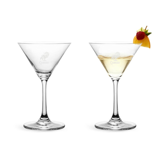 A classic martini glass, featuring a clear, elegant design with a pointed bowl and a sturdy base.