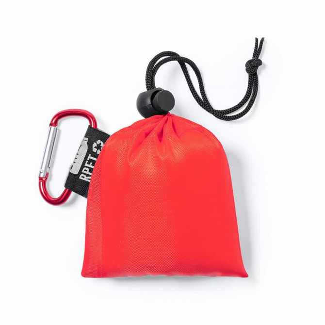 A red pouch with a drawstring and a carabiner, made from RPET material, containing a poncho.