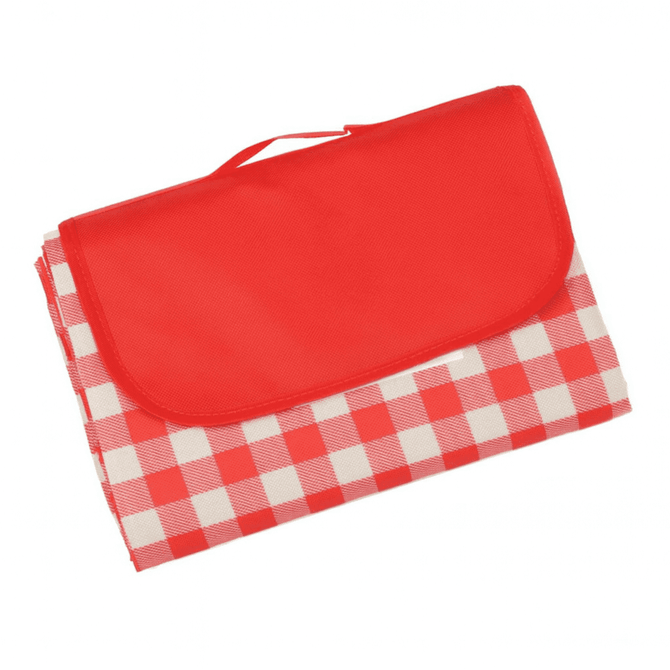 A red and white checkered picnic blanket, folded with a red carry handle. The blanket features a waterproof backing and branding.