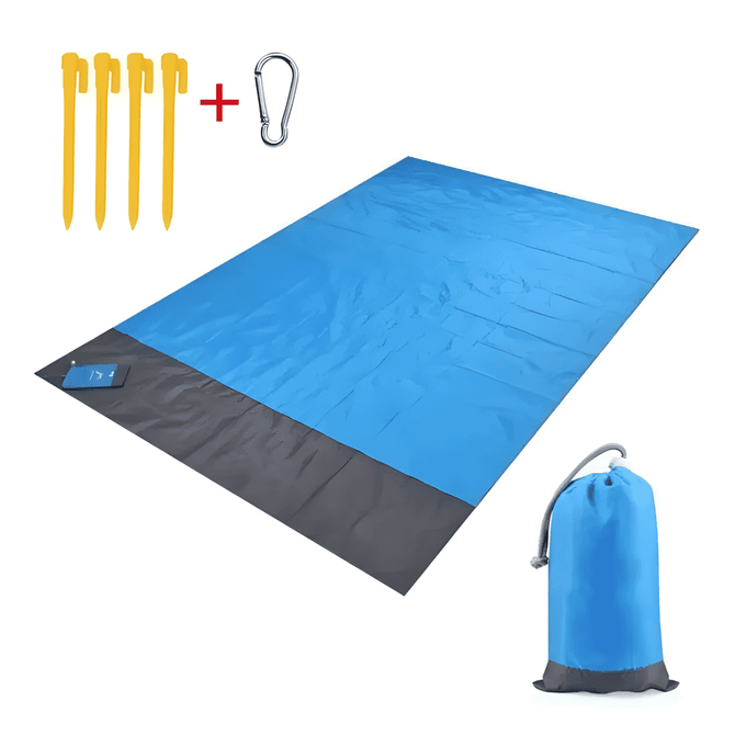 A blue and grey polyester picnic blanket laid out, accompanied by yellow pegs and a grey pouch with a carabiner.