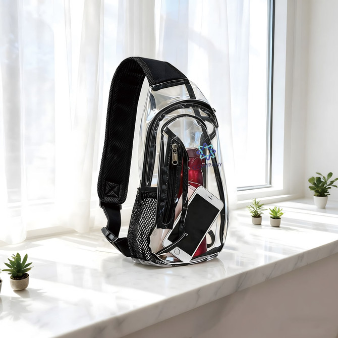 A large clear bag with a black shoulder strap, featuring a phone, drink bottle, and multiple compartments.