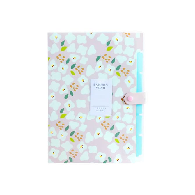 A pink expandable file folder featuring a floral pattern in white, yellow, and green, with a button closure.