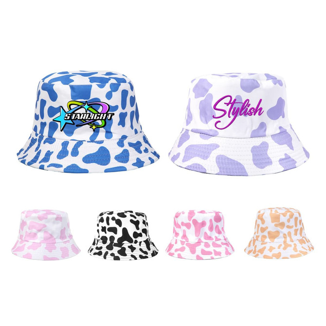 A collection of bucket hats in various colours, featuring cow print patterns in blue, pink, black, and orange.