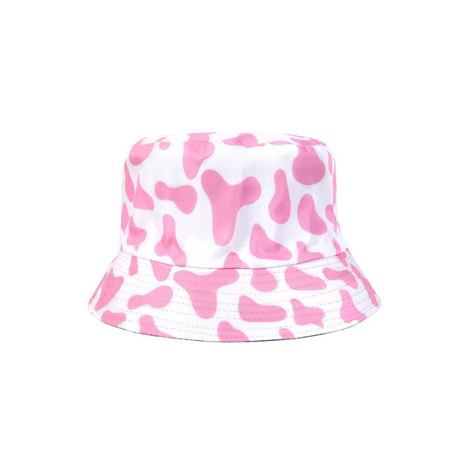 A pink and white bucket hat featuring a cow print design, with a simple logo on it.