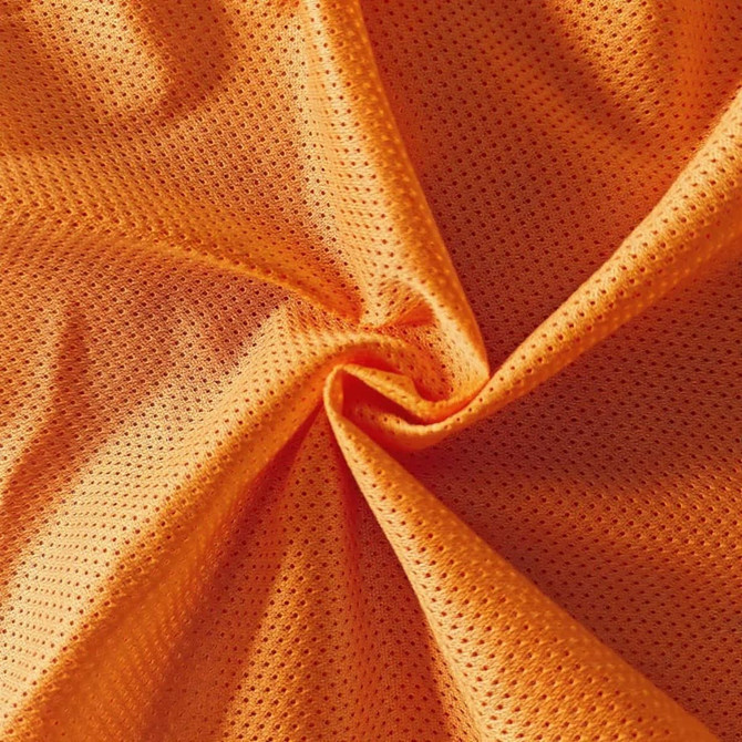 An orange polyester micro mesh fabric featuring a breathable, textured surface. It has a vivid hue and a soft feel.