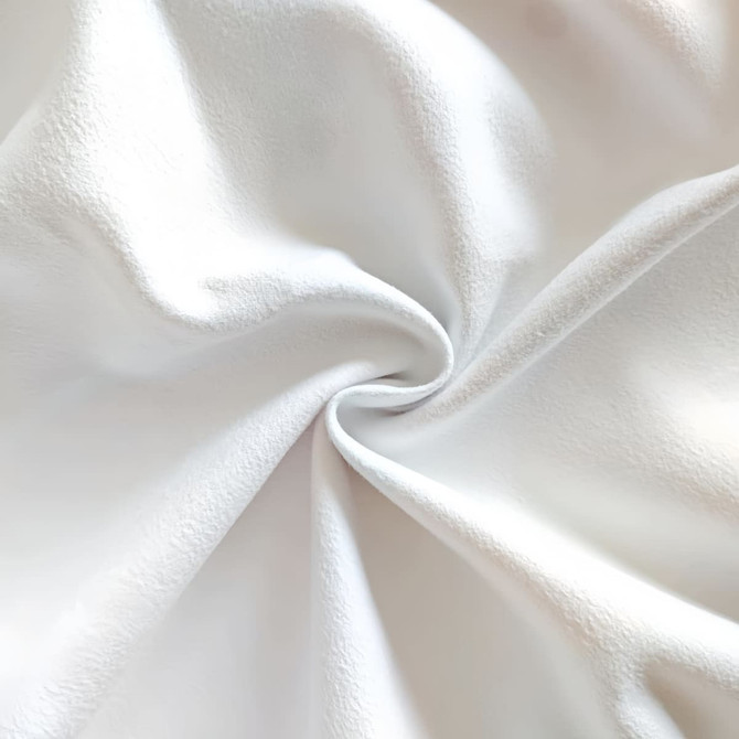 A close-up view of soft, white fleece fabric with a smooth texture.