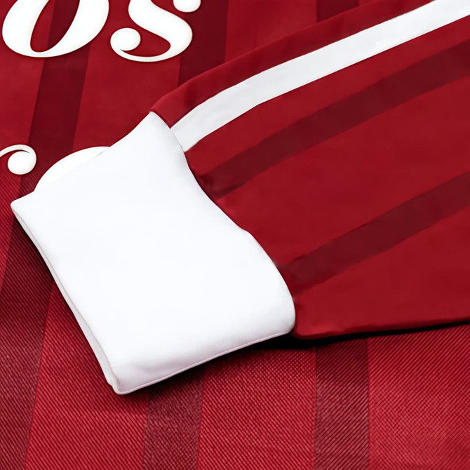 A red and white striped football jersey featuring a white sleeve and a logo.