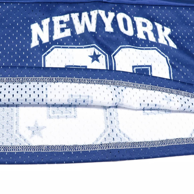 A blue sports jersey featuring a mesh design and a logo. The jersey includes a number and is made from 100% polyester.