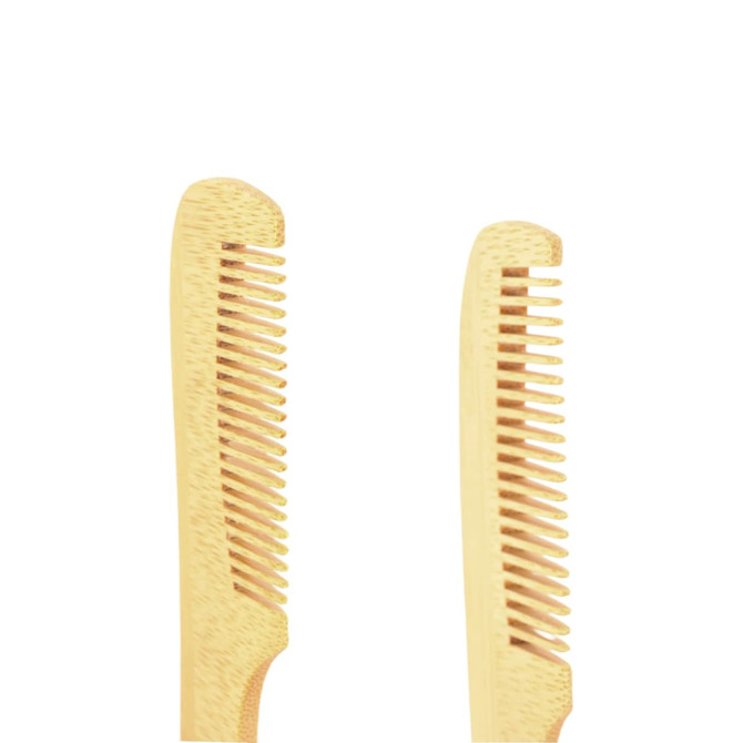 A natural small bamboo comb with handle, featuring a light golden colour and a simple design.