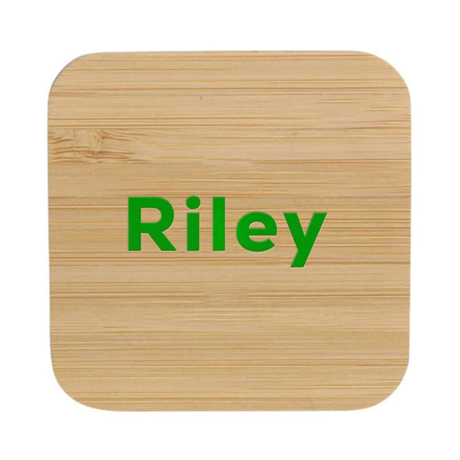 A bamboo wireless charger with rounded corners and a green logo, featuring a natural wood finish.