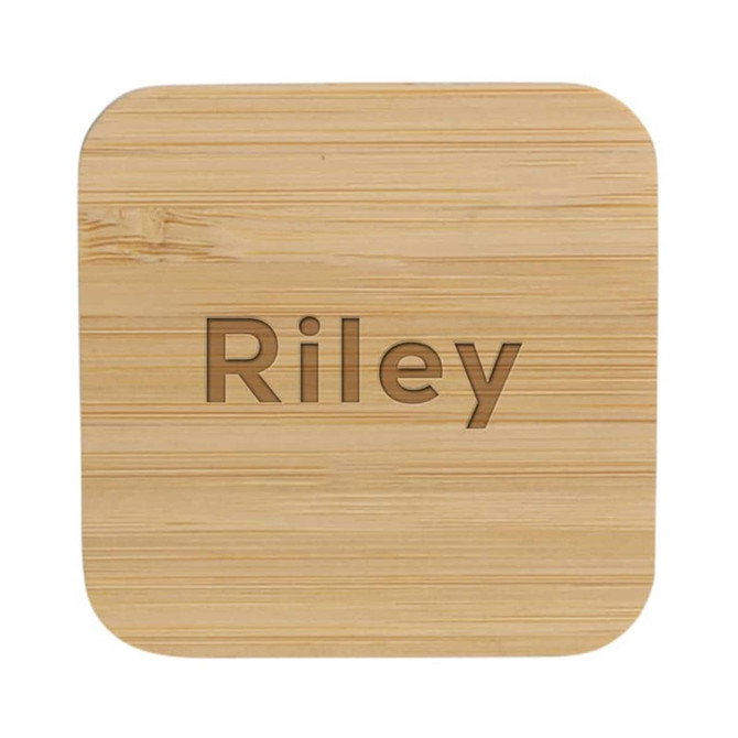 A bamboo wireless charger with a smooth, natural finish and rounded edges. It features a logo on the surface.