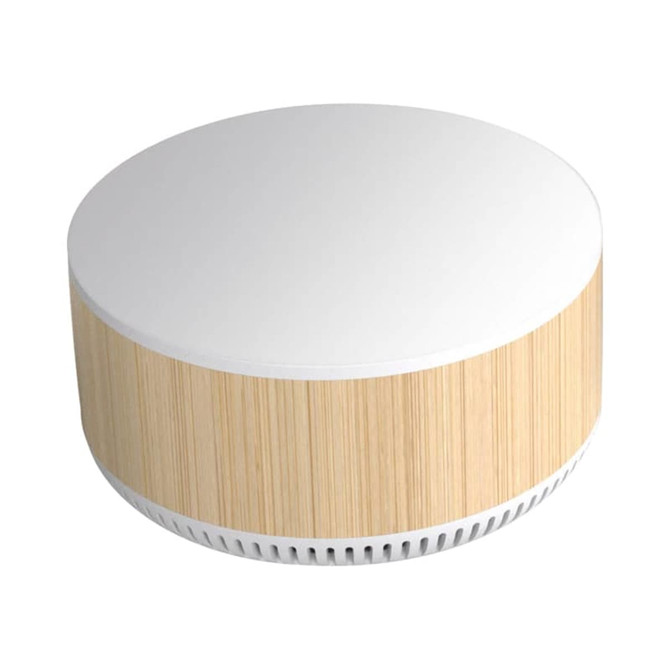 A round speaker with a white top and a bamboo-style finish, featuring a minimalist design and a logo.