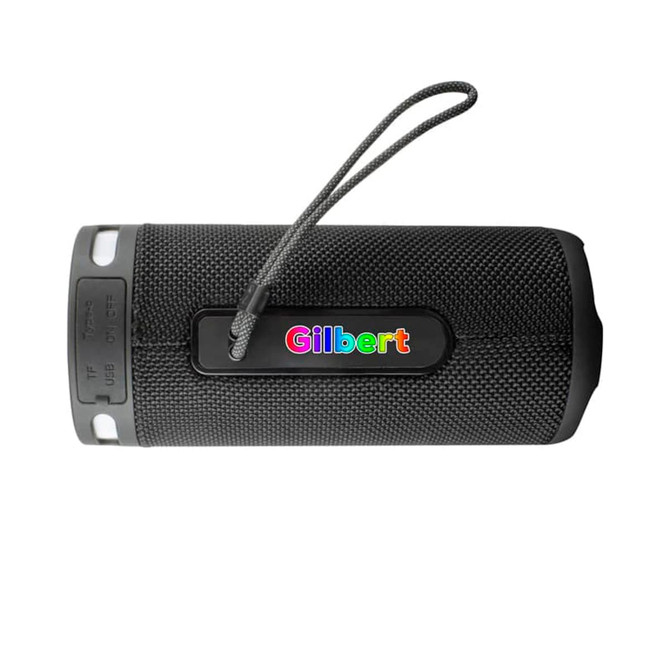 A black wireless speaker with a textured surface and a carrying strap, featuring a branding logo.