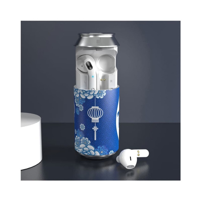 A blue-patterned can cooler with white Cannery TWS earbuds partially visible inside, alongside a white earbud on a countertop.