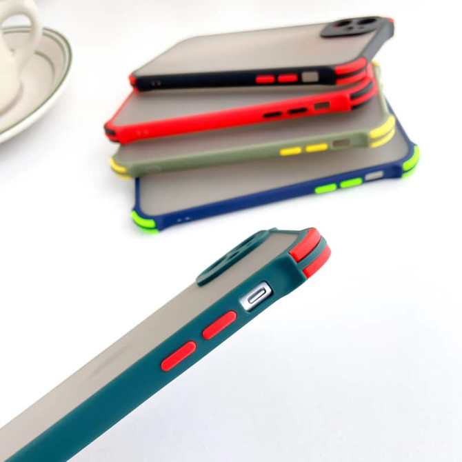 A collection of colourful rugged iPhone cases in various shades, featuring multiple buttons and cut-outs, stacked at an angle.