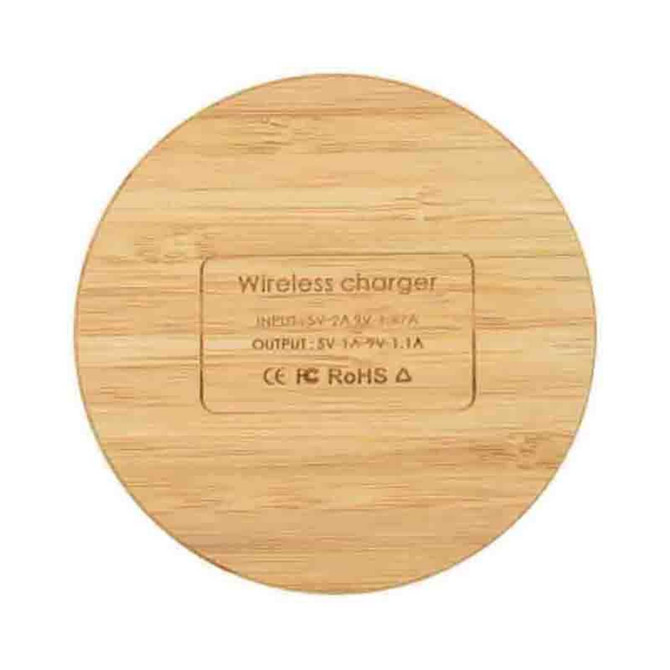 A round bamboo wireless charger with a smooth surface and a hidden logo on the bottom.