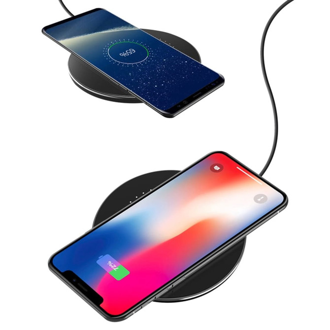 A black 10W wireless charger with two smartphones resting on it, one displaying a charging indicator. A black 10W wireless charger with two smartphones resting on it, one displaying a charging indicator.