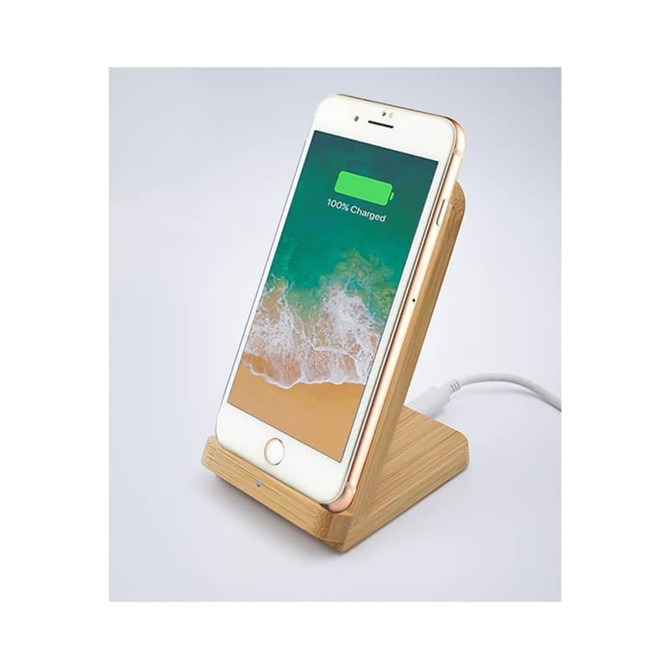 A bamboo wireless charger in natural tones with a smartphone displaying a fully charged battery. Features a logo.