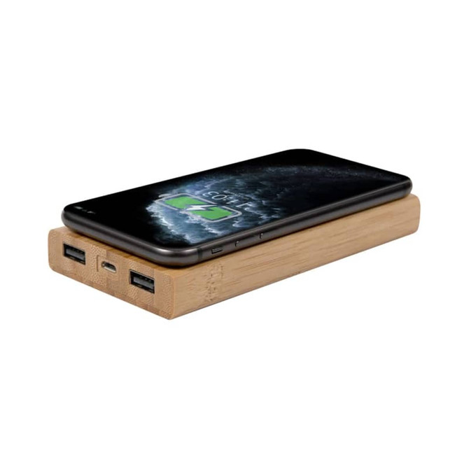 A bamboo wireless power bank in natural wood finish, featuring two USB ports and a smartphone on top.