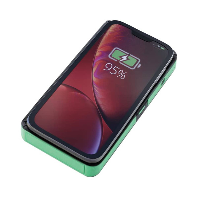 A green Europa Solar Wireless Power Bank with a phone displaying a charging indicator on the screen.