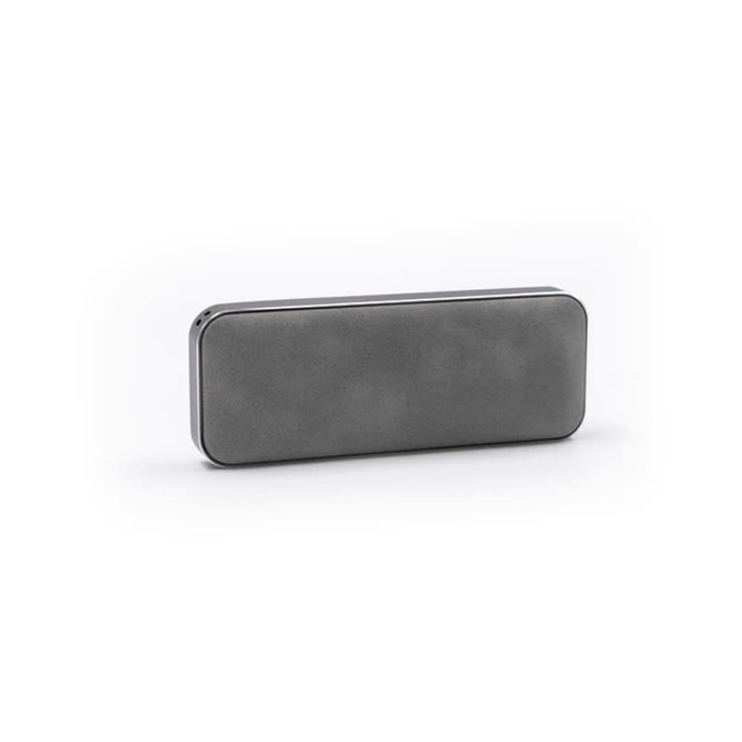 A grey Bluetooth speaker with a sleek, rectangular design and a minimalistic appearance, featuring a logo.