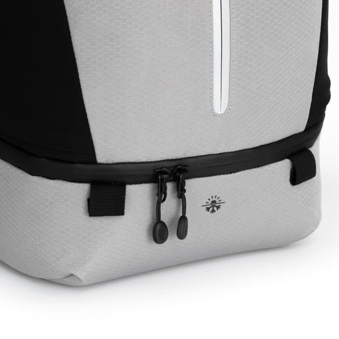 A grey and black eco backpack featuring a hexagonal pattern and a zip closure at the top. It has a logo on the side.