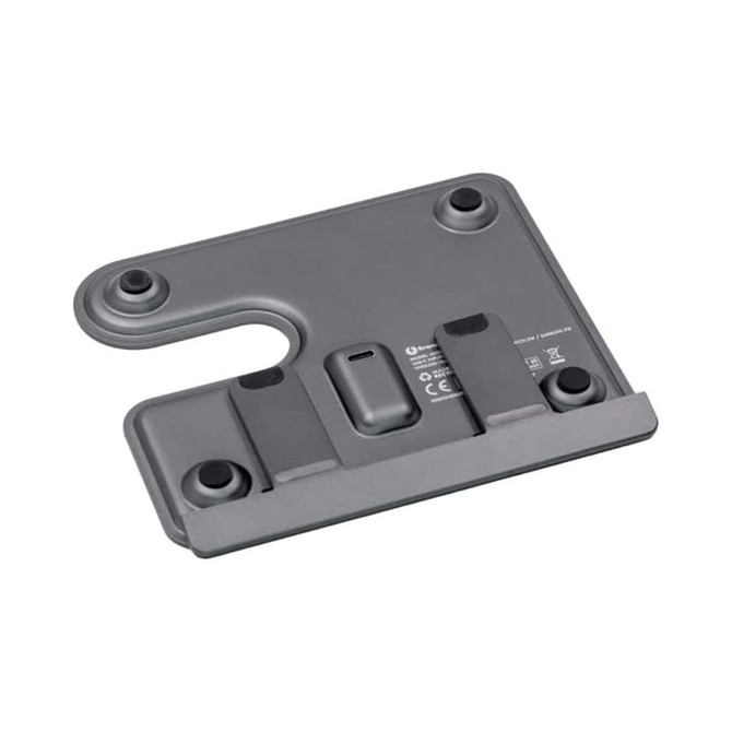 A grey wireless charging stand with multiple slots for devices, featuring a logo and round rubber feet. A grey wireless charging stand with multiple slots for devices, featuring a logo and round rubber feet.