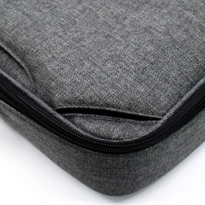 A grey laptop bag featuring a textured fabric and a zip closure. It includes a branding logo. A grey laptop bag featuring a textured fabric and a zip closure. It includes a branding logo.