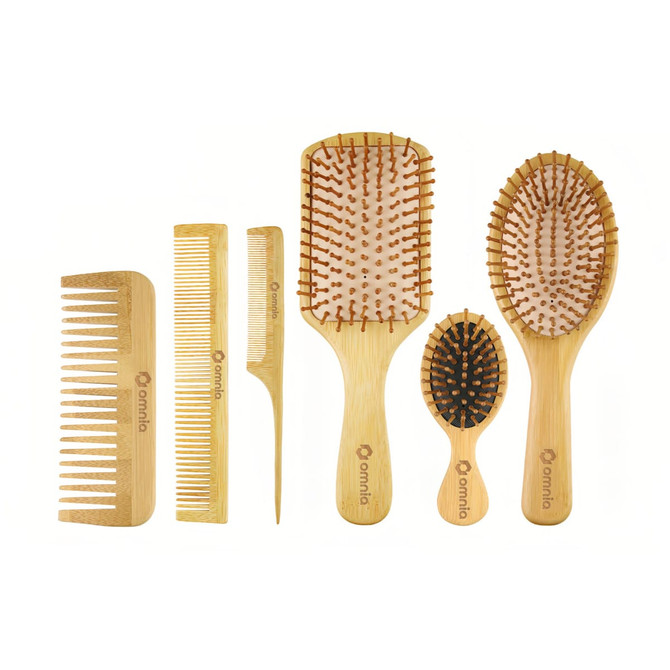 A set of bamboo combs and brushes in various sizes and styles, featuring natural wood tones and a branding logo.