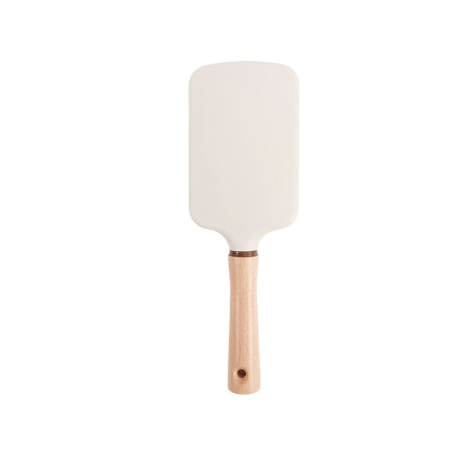 A paddle brush with a white head and a light wooden handle, featuring a circular hole at the base.