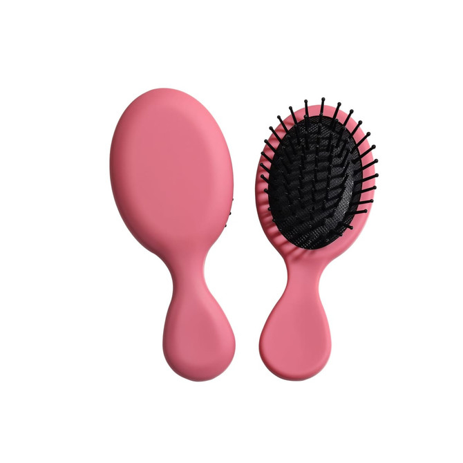 A pink mini paddle brush with a flexible base and black bristles, featuring a logo on the handle.