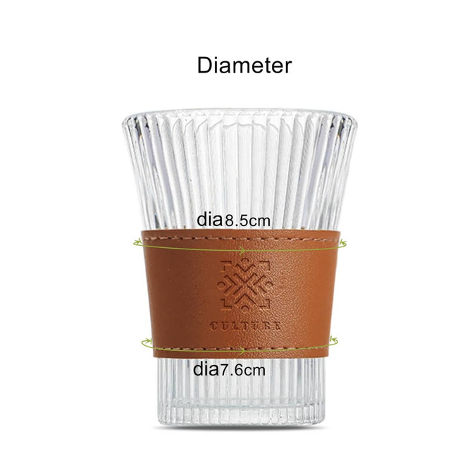 A clear glass cup with a brown leather sleeve, featuring a brand logo, highlighting its dimensions.
