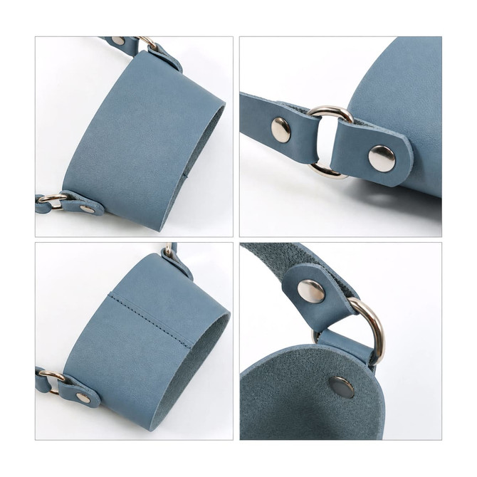 A drink bottle holder made of blue leather with silver metal hardware and adjustable straps.