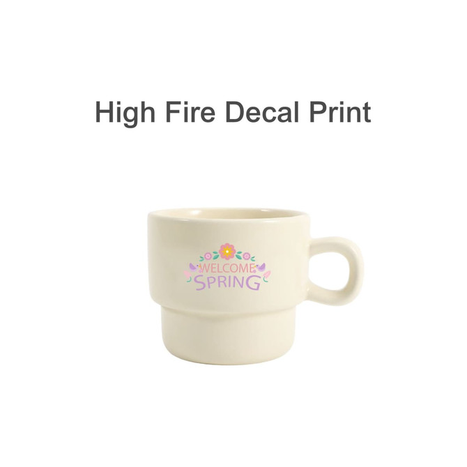 A stackable ceramic mug in cream with a floral design and branding visible.