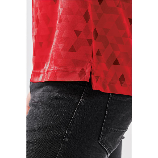 A red polo shirt featuring a geometric pattern and a small logo, displayed with black pants.