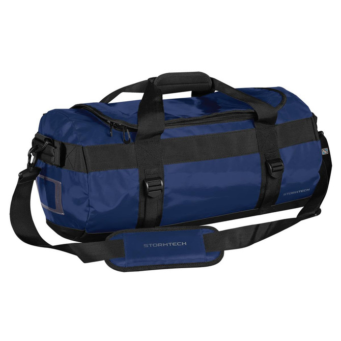 A small blue duffle bag with black straps and branding, featuring a zippered top and side grab handle.