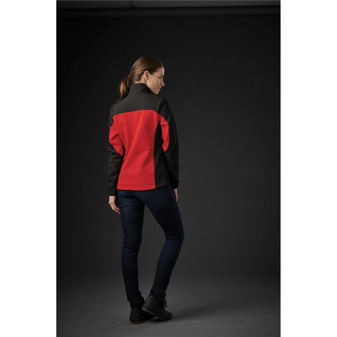 A women’s softshell jacket featuring a black and red design, displayed from the back against a dark background.