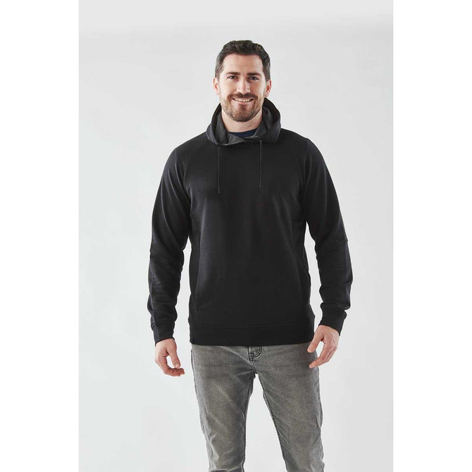 Men's black performance hoody with a hood, worn by a smiling man, paired with light grey jeans.