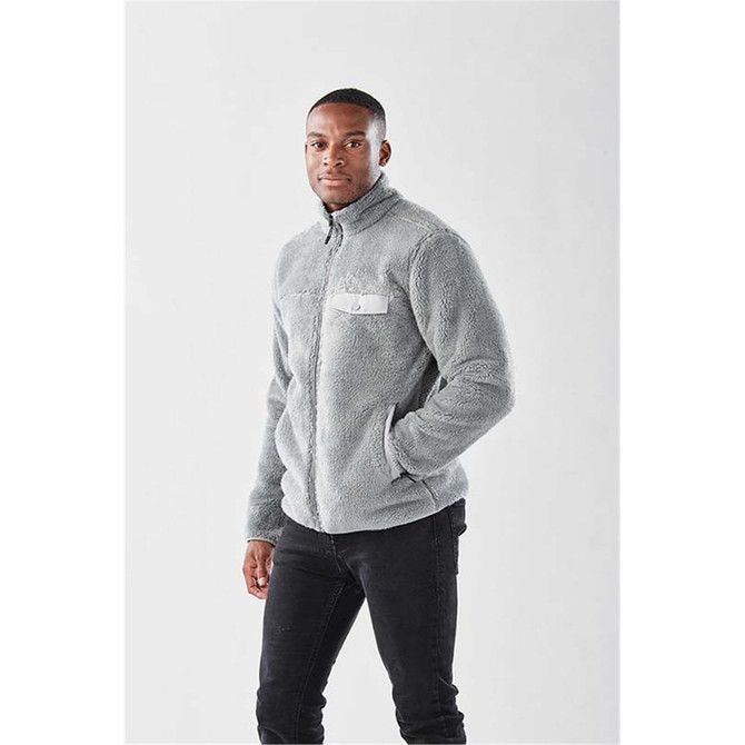 A grey men's Bergen Sherpa fleece jacket with a chest pocket and a logo, worn by a male model.