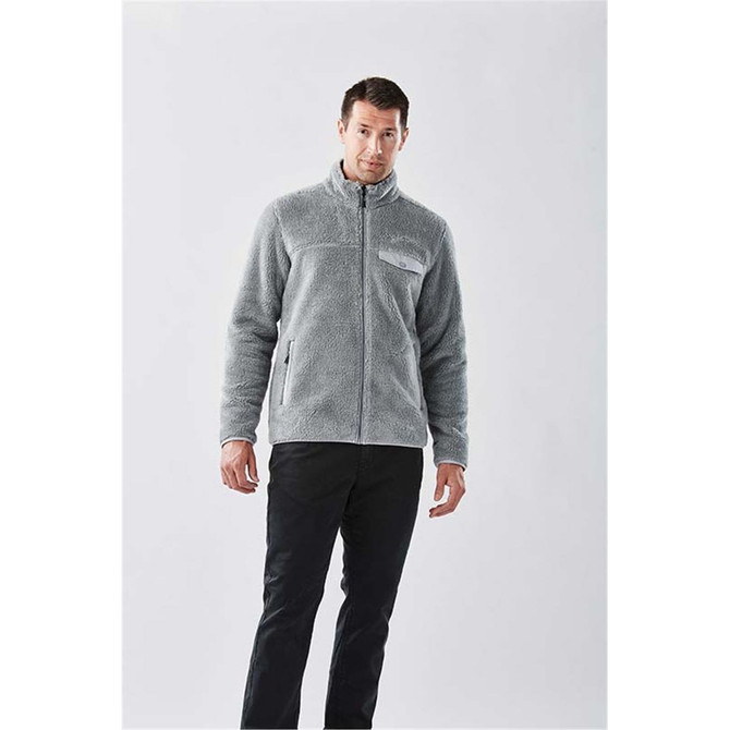 A men's grey Sherpa fleece jacket with a zip front and pockets, featuring a logo on the chest.